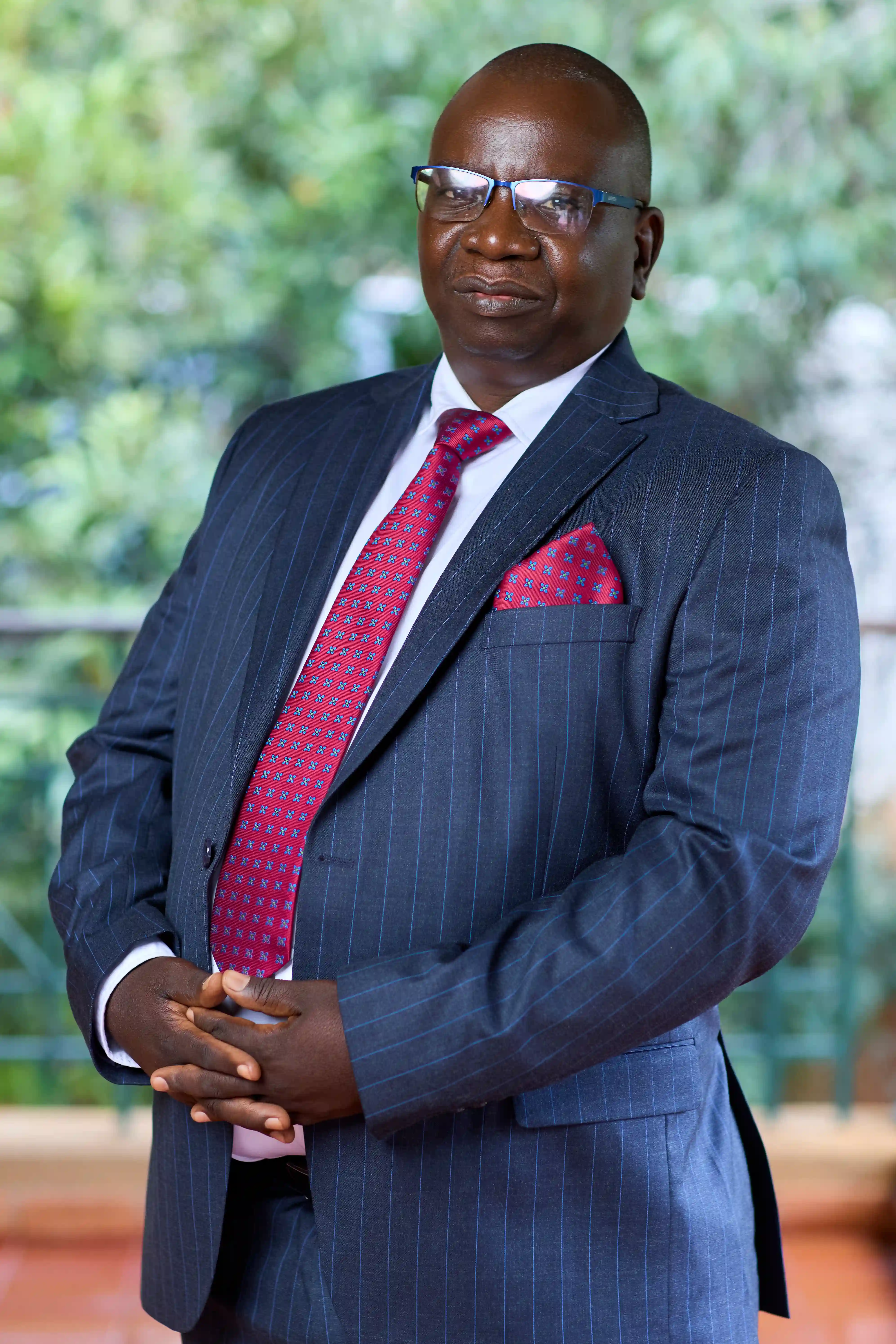 Dr. Cosmas Kanhai